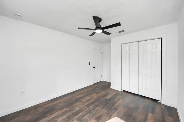 a view of a big room with wooden floor