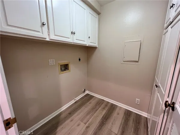 a view of storage and utility room with closet