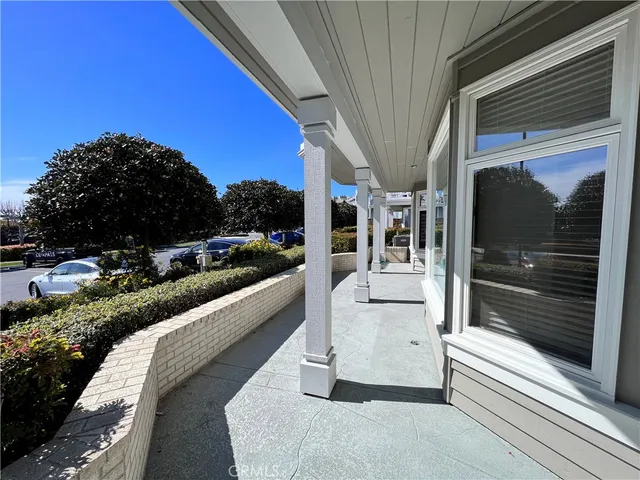 a view of balcony with furniture