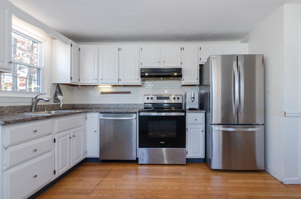 15 Chatham Road Plymouth, MA 02360 - Photo 15 of 35 a kitchen with granite countertop white cabinets and stainless steel appliances