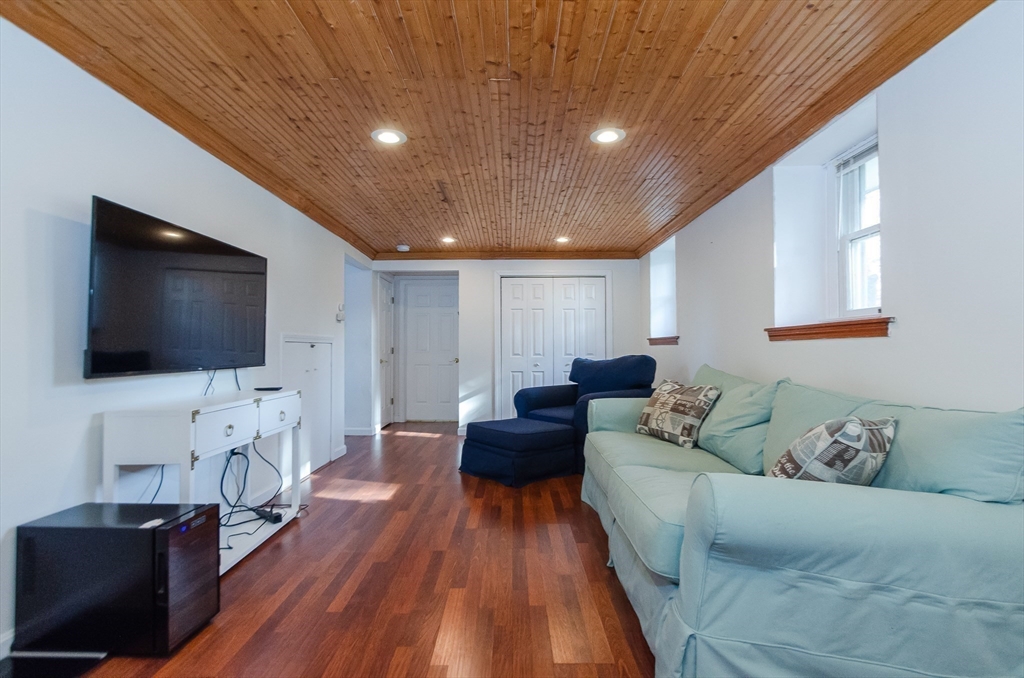 15 Chatham Road Plymouth, MA 02360 - Photo 25 of 35 a living room with furniture and a flat screen tv