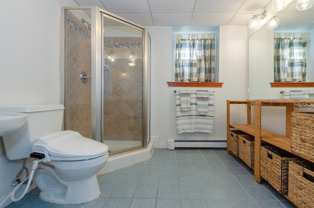 15 Chatham Road Plymouth, MA 02360 - Photo 26 of 35 a bathroom with a toilet a sink and shower
