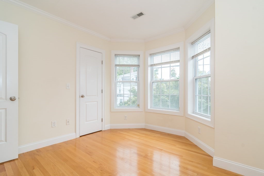 123 Russell Street, Unit 1 Waltham, MA 02453 - Photo 3 of 12 a view of an empty room with a window