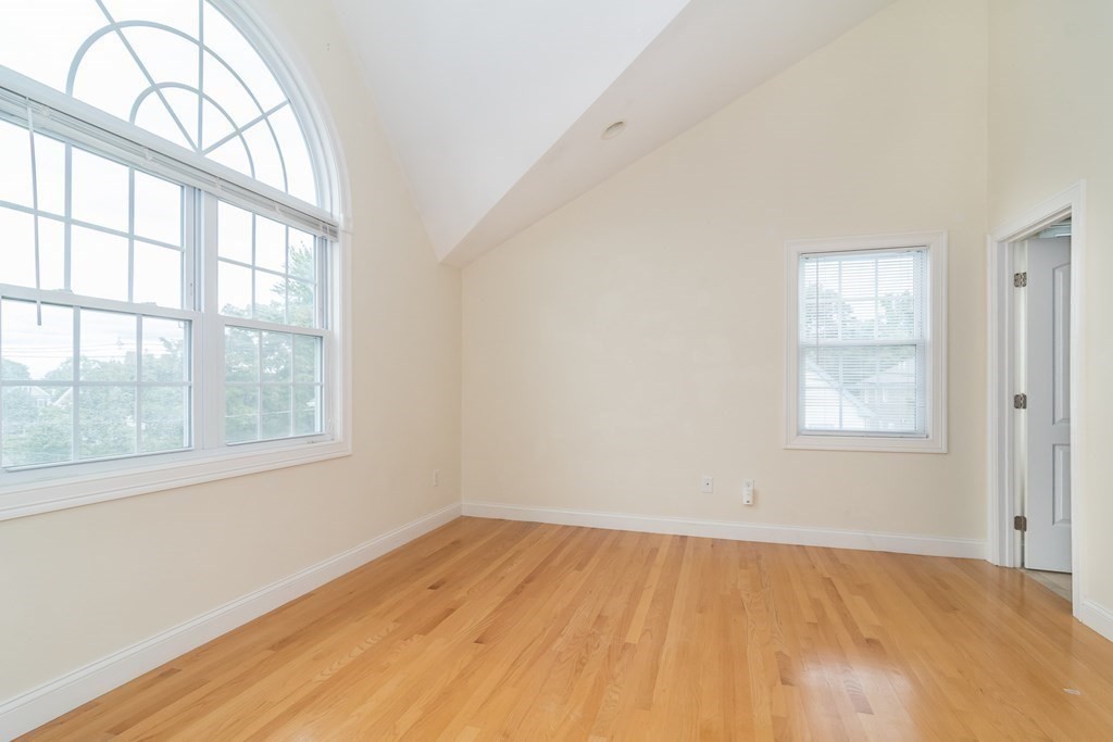 123 Russell Street, Unit 1 Waltham, MA 02453 - Photo 10 of 12 an empty room with a window