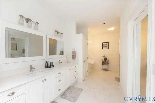 a spacious bathroom with sinks mirror and a shower