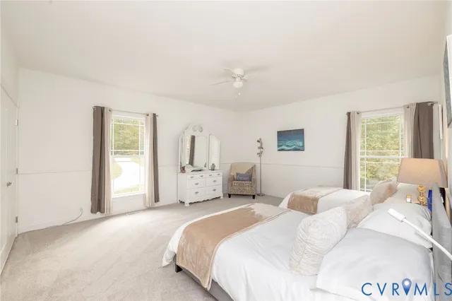 a bedroom with a bed and a chair