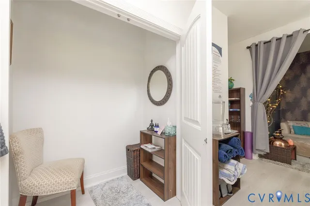 a room with cabinets and a chair