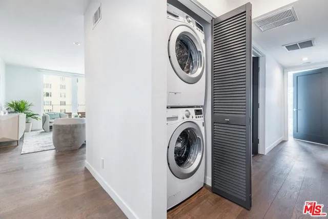 a view of a hallway with washer and dryer