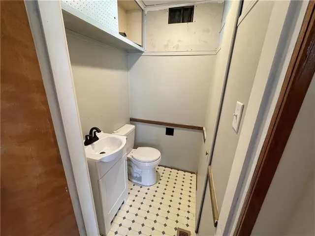 a bathroom with a sink and a toilet