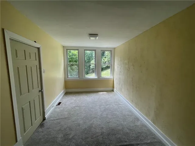 an empty room with windows