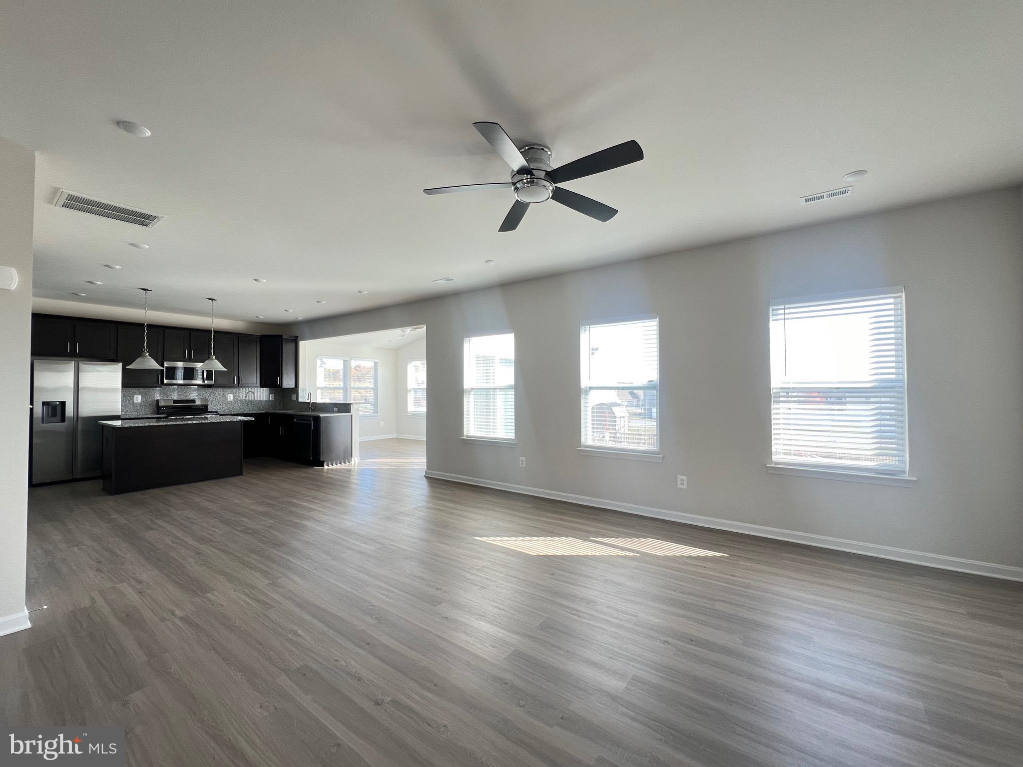 35 Signal Knob Cottage Drive Strasburg, VA 22657 - Photo 23 of 30 a view of a kitchen with furniture and wooden floor