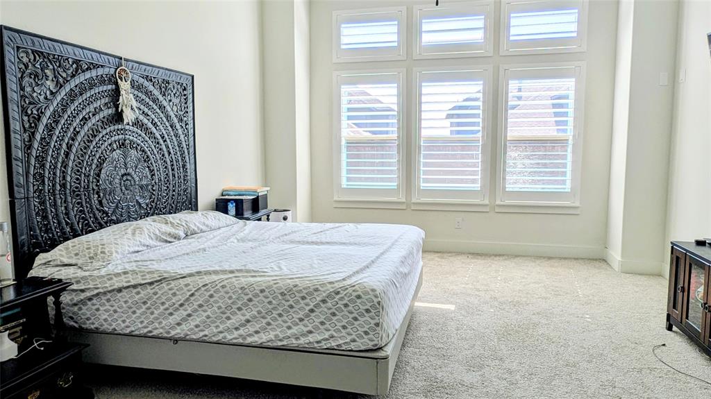 8933 Frostweed Road Frisco, TX 75035 - Photo 15 of 36 a bedroom with a bed and a window