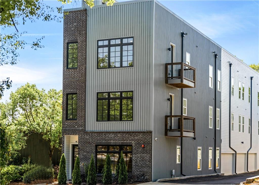 417 East College Avenue, Unit 202 Decatur, GA 30030 - Photo 1 of 1 a front view of a house with large windows