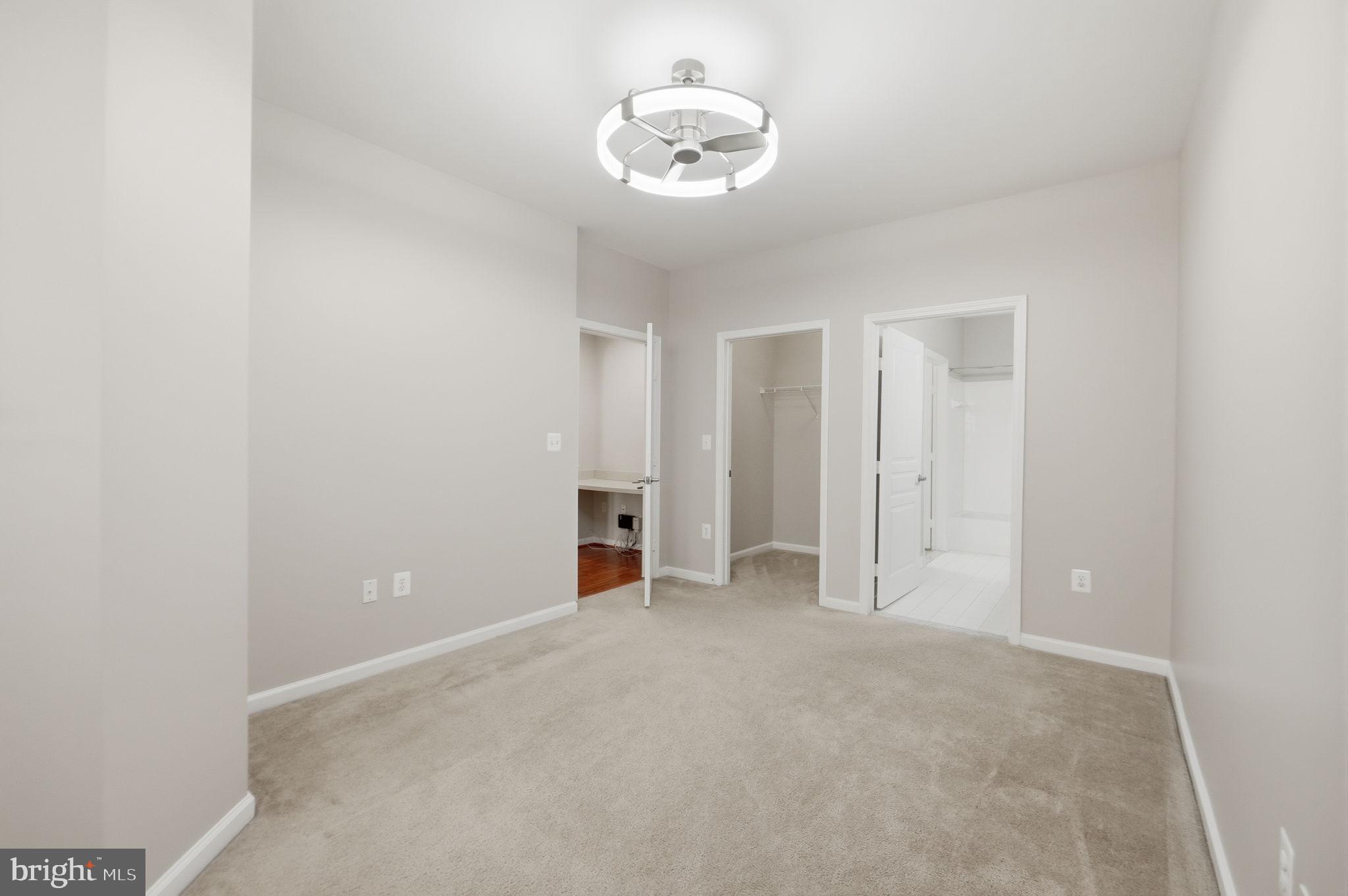 12001 Market Street, Unit 140 Reston, VA 20190 - Photo 23 of 48 Spacious, light-filled bedroom retreat.