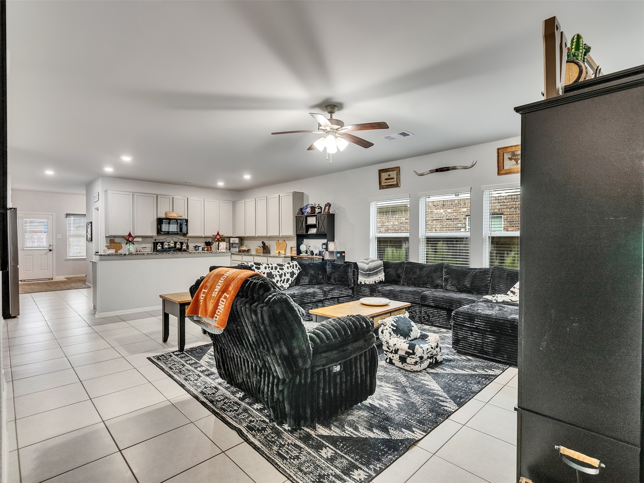 8719 Willet Street Baytown, TX 77521 - Photo 10 of 42 a living room with furniture and kitchen view