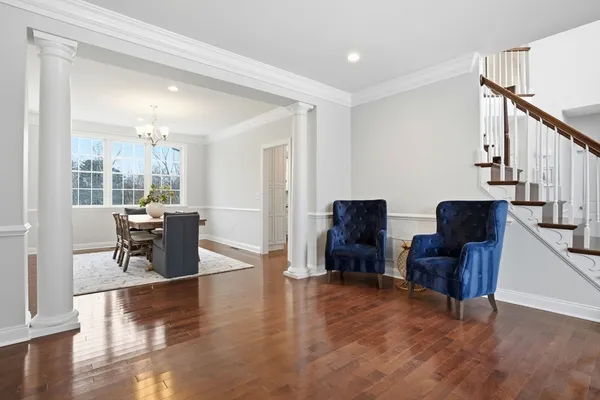 a living room with furniture a rug and a window