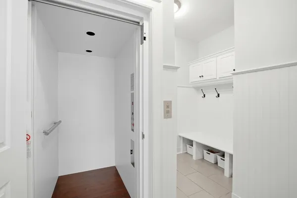 a bedroom with furniture and a wooden floor