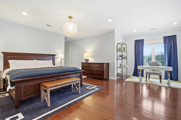 a large bathroom with a double vanity sink a large mirror and a shower