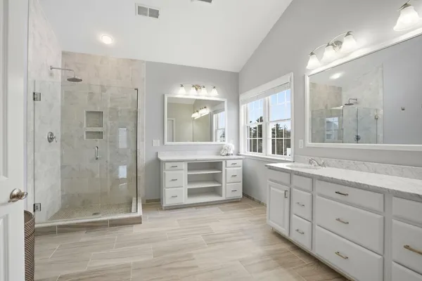 a bathroom with a sink toilet and shower