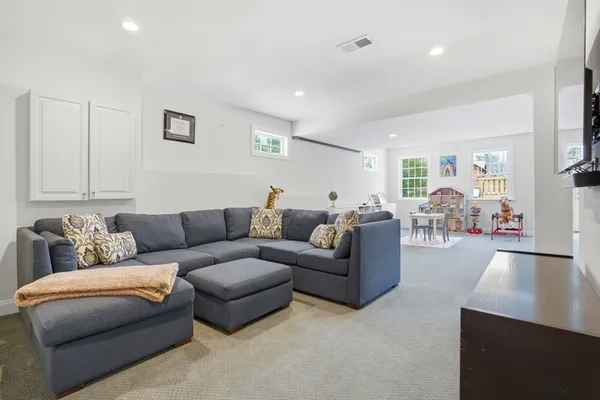 a view of a lobby with furniture and a wooden floor