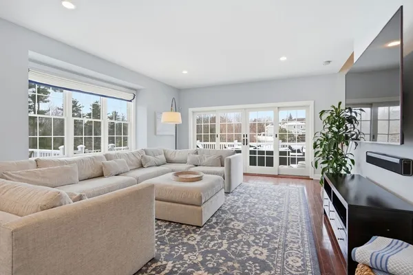 a view of a dining room with furniture wooden floor and chandelier