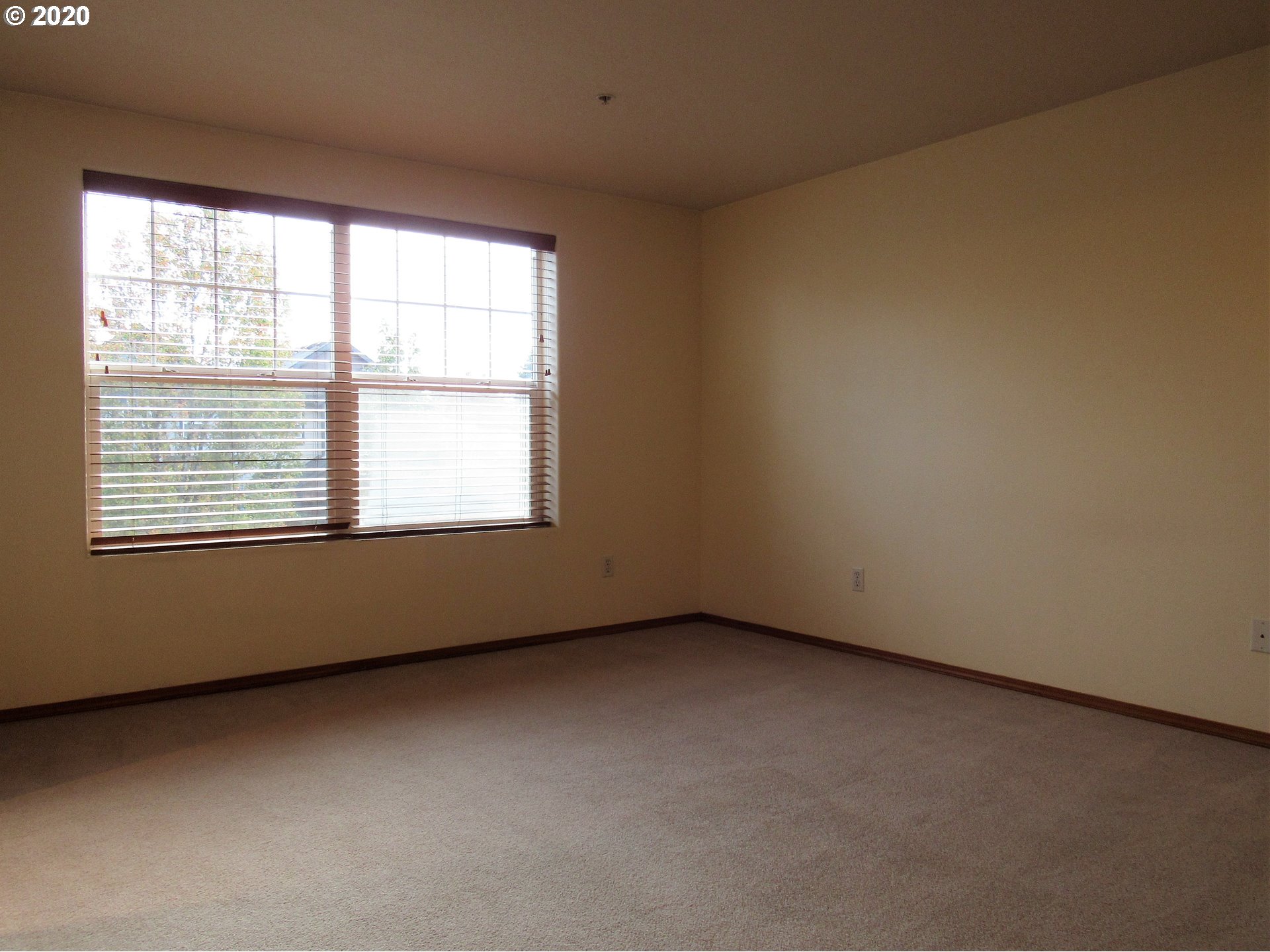 1244 Southwest 160th Avenue, Unit 101 Beaverton, OR 97006 - Photo 13 of 24 an empty room with a window
