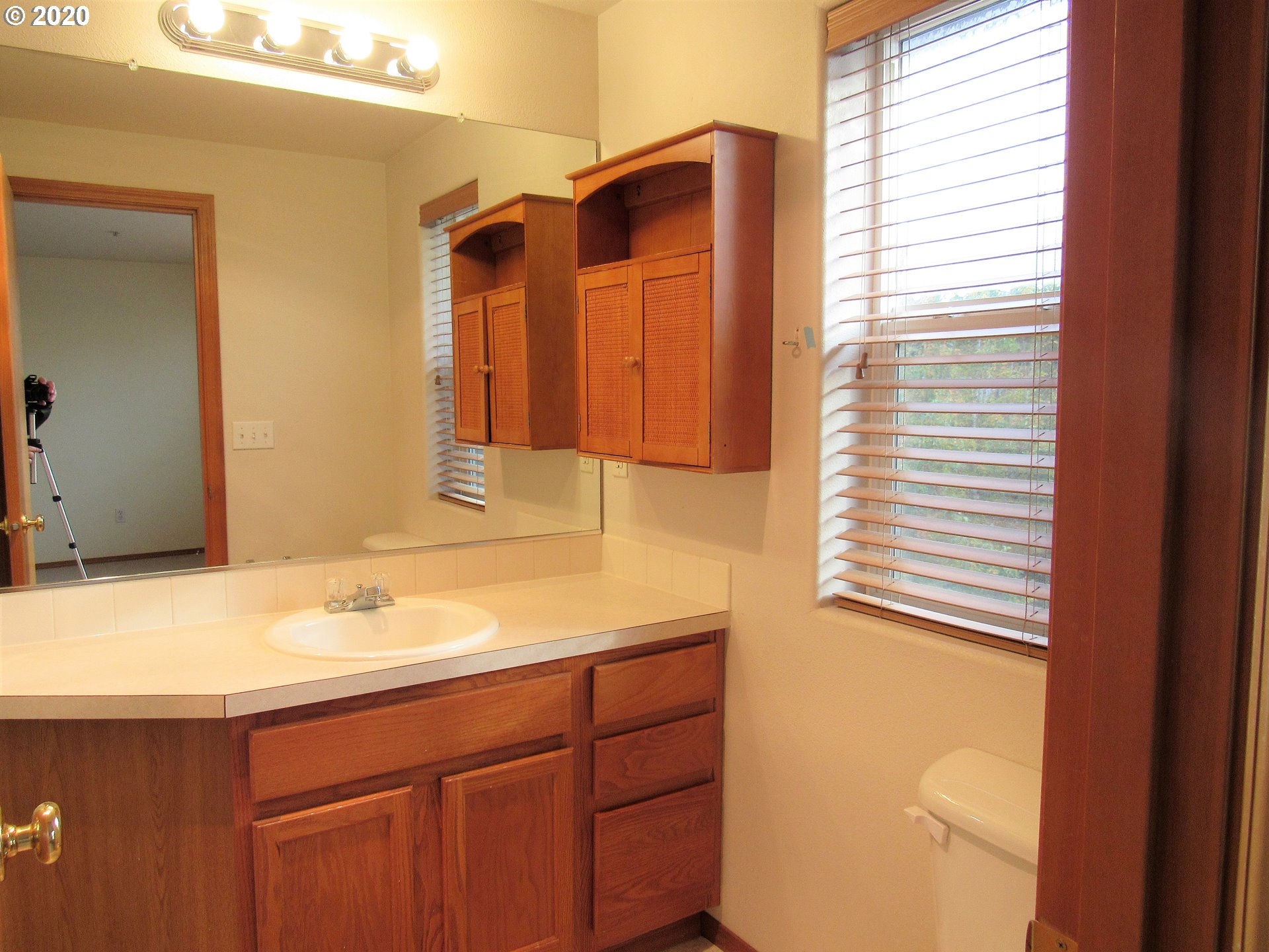 1244 Southwest 160th Avenue, Unit 101 Beaverton, OR 97006 - Photo 16 of 24 a bathroom with a sink and a mirror