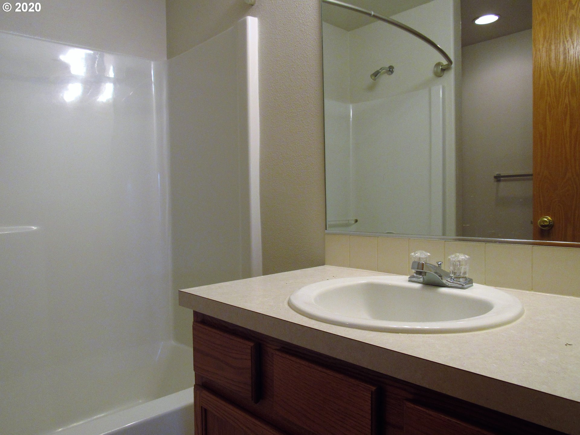 1244 Southwest 160th Avenue, Unit 101 Beaverton, OR 97006 - Photo 19 of 24 a bathroom with a sink and a mirror