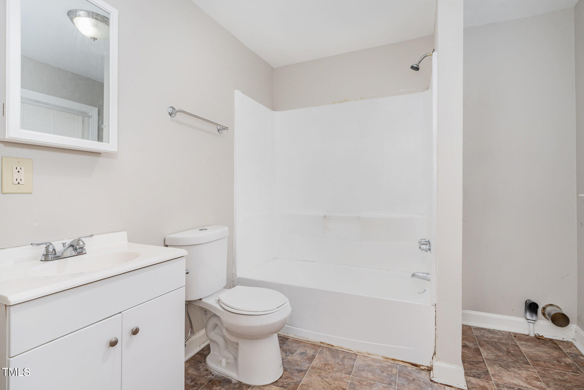 4505 Laymans Chapel Road Durham, NC 27704 - Photo 13 of 20 a bathroom with a sink a toilet and shower