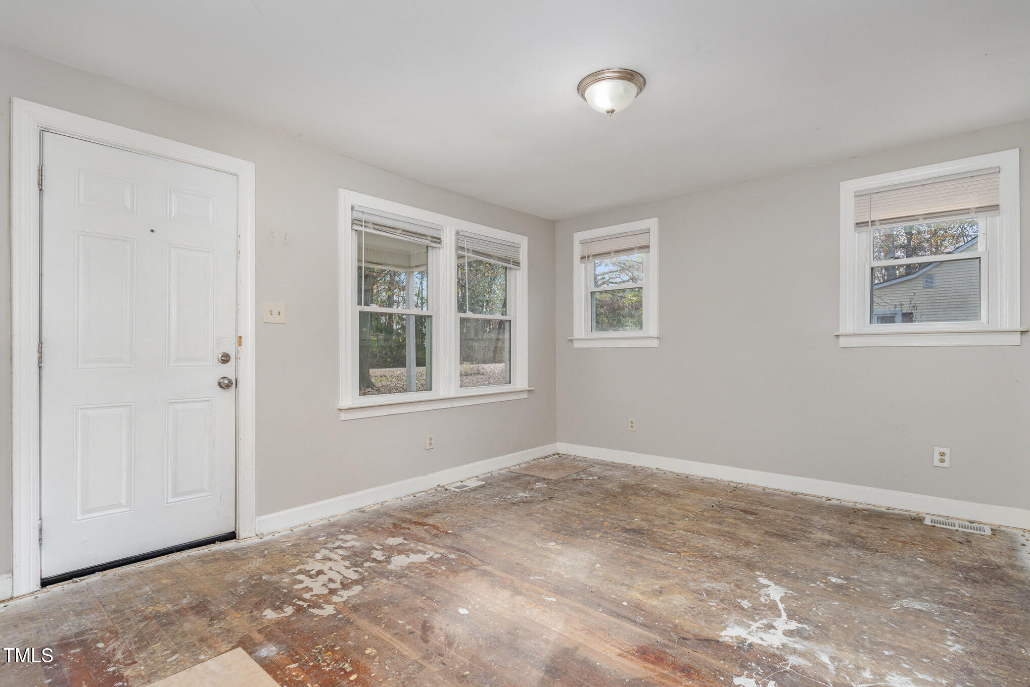 4505 Laymans Chapel Road Durham, NC 27704 - Photo 3 of 20 a view of an empty room with a window