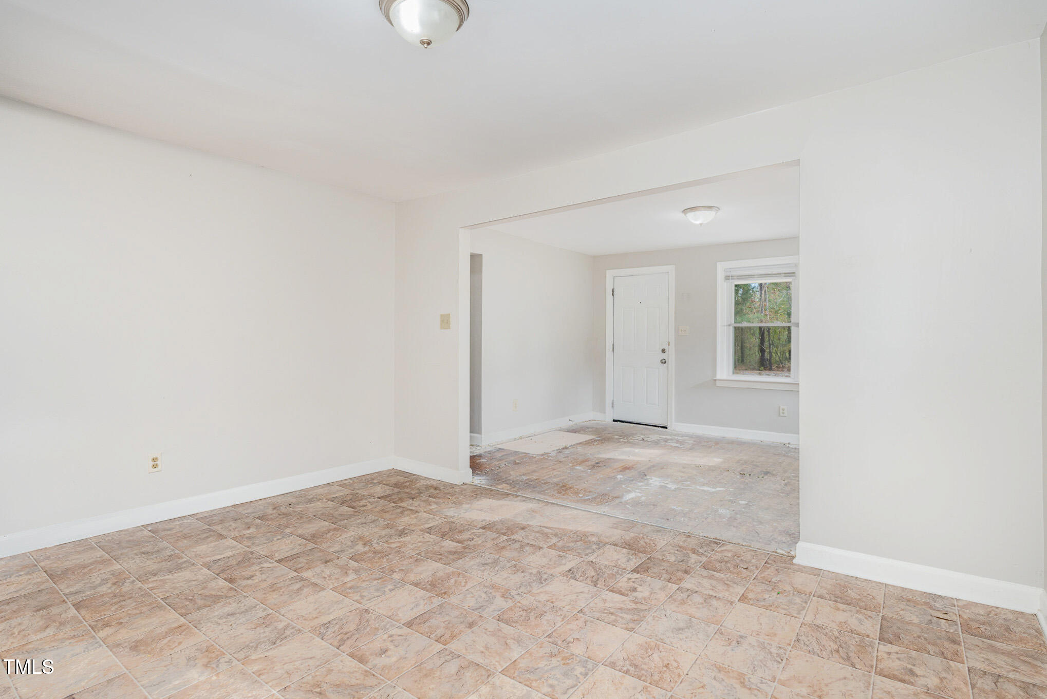 4505 Laymans Chapel Road Durham, NC 27704 - Photo 5 of 20 an empty room with a natural light