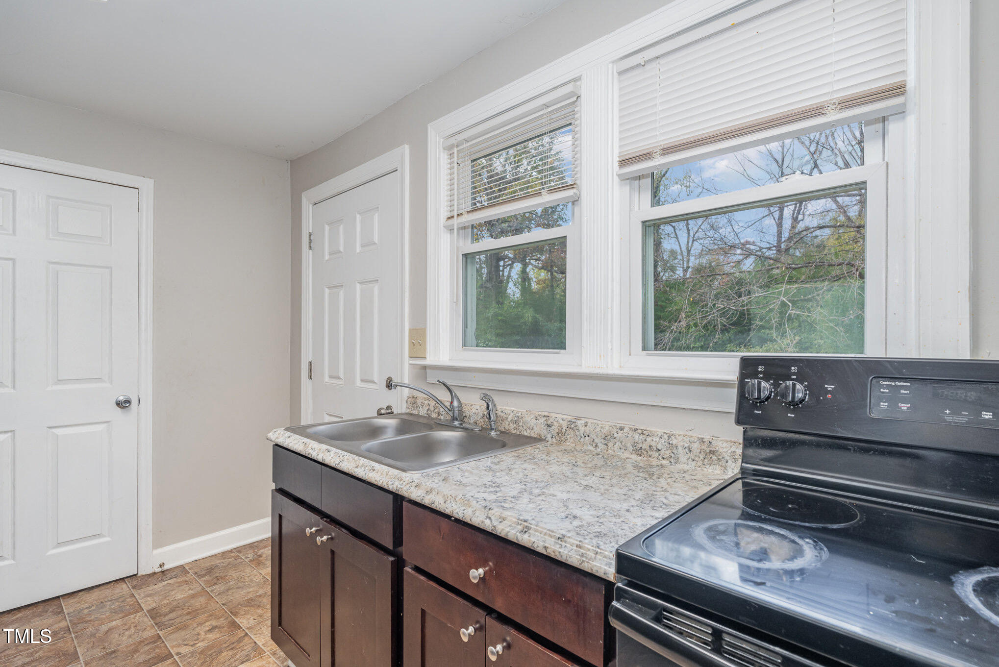 4505 Laymans Chapel Road Durham, NC 27704 - Photo 8 of 20 a view of a sink and a living room