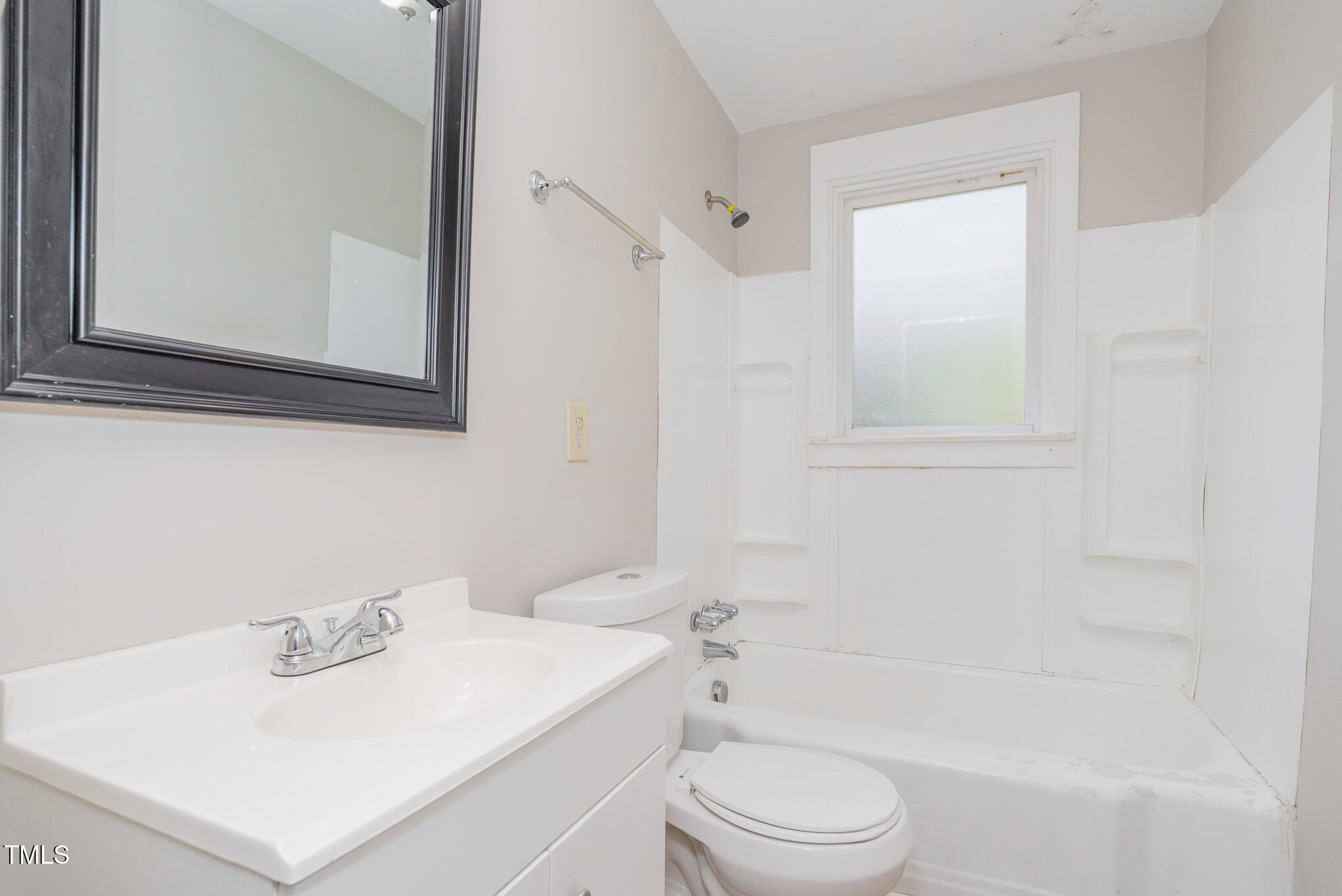 4505 Laymans Chapel Road Durham, NC 27704 - Photo 9 of 20 a bathroom with a sink a toilet and shower