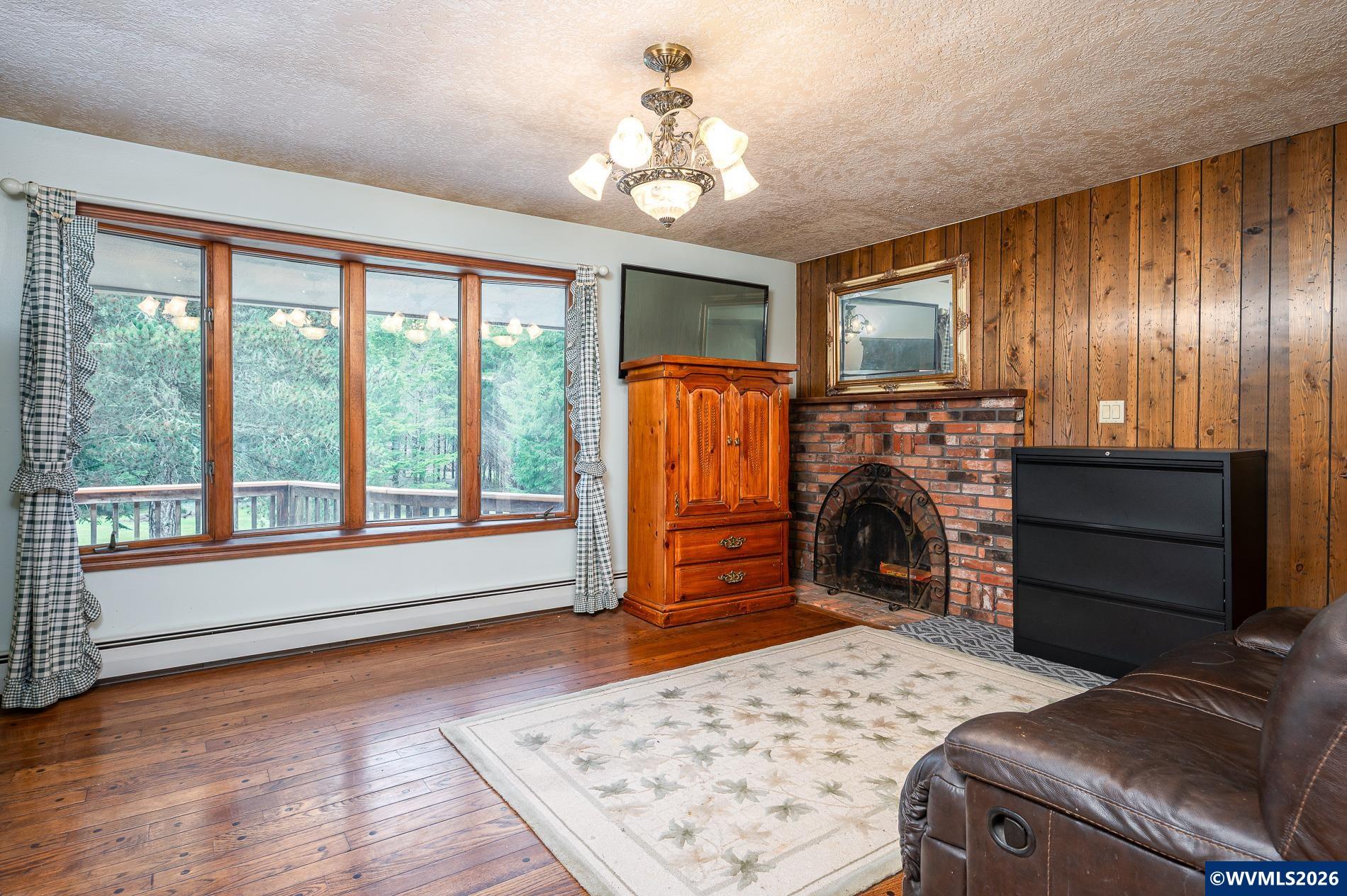 27572 South Kinzy Road Estacada, OR 97023 - Photo 18 of 50 a bed room with a bed and a chair