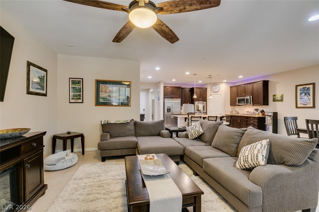 7375 Campbell Ranch Avenue Las Vegas, NV 89179 - Photo 19 of 45 An inviting open-concept layout connects the living room to a modern kitchen, ideal for entertaining.