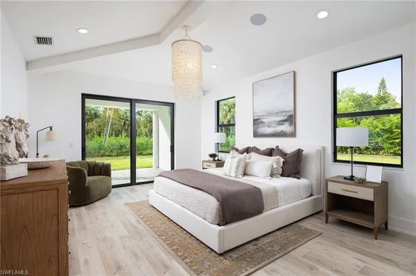 a bedroom with a large bed and a large window