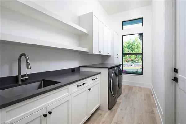 a kitchen with a sink and cabinets