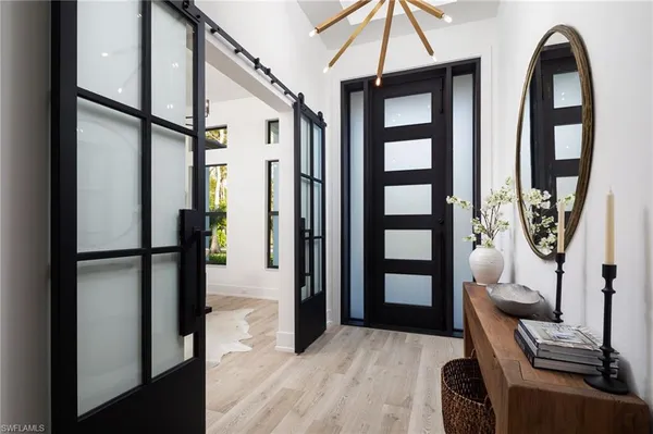 a view of livingroom with furniture and front door