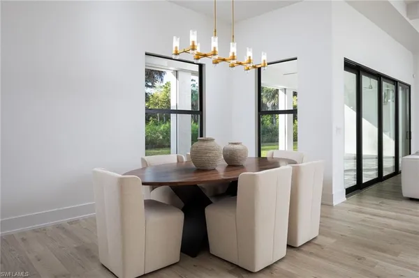 a dining room with furniture and window