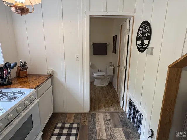 a kitchen with a refrigerator and a stove