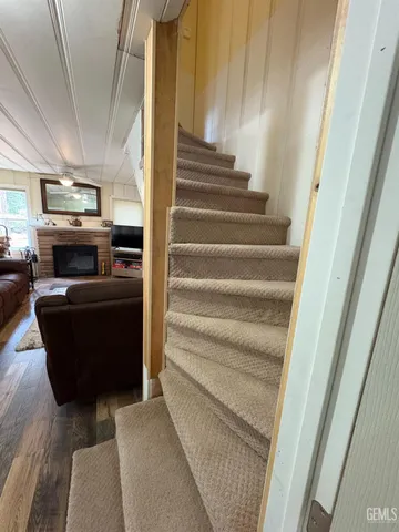 a bedroom with a bed and a large mirror