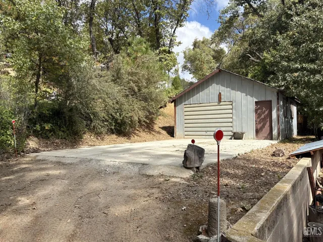 a view of a backyard of the house