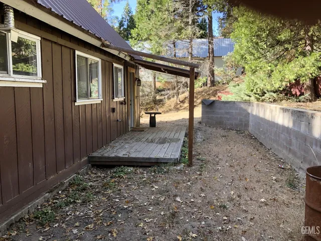 a view of a backyard with a patio