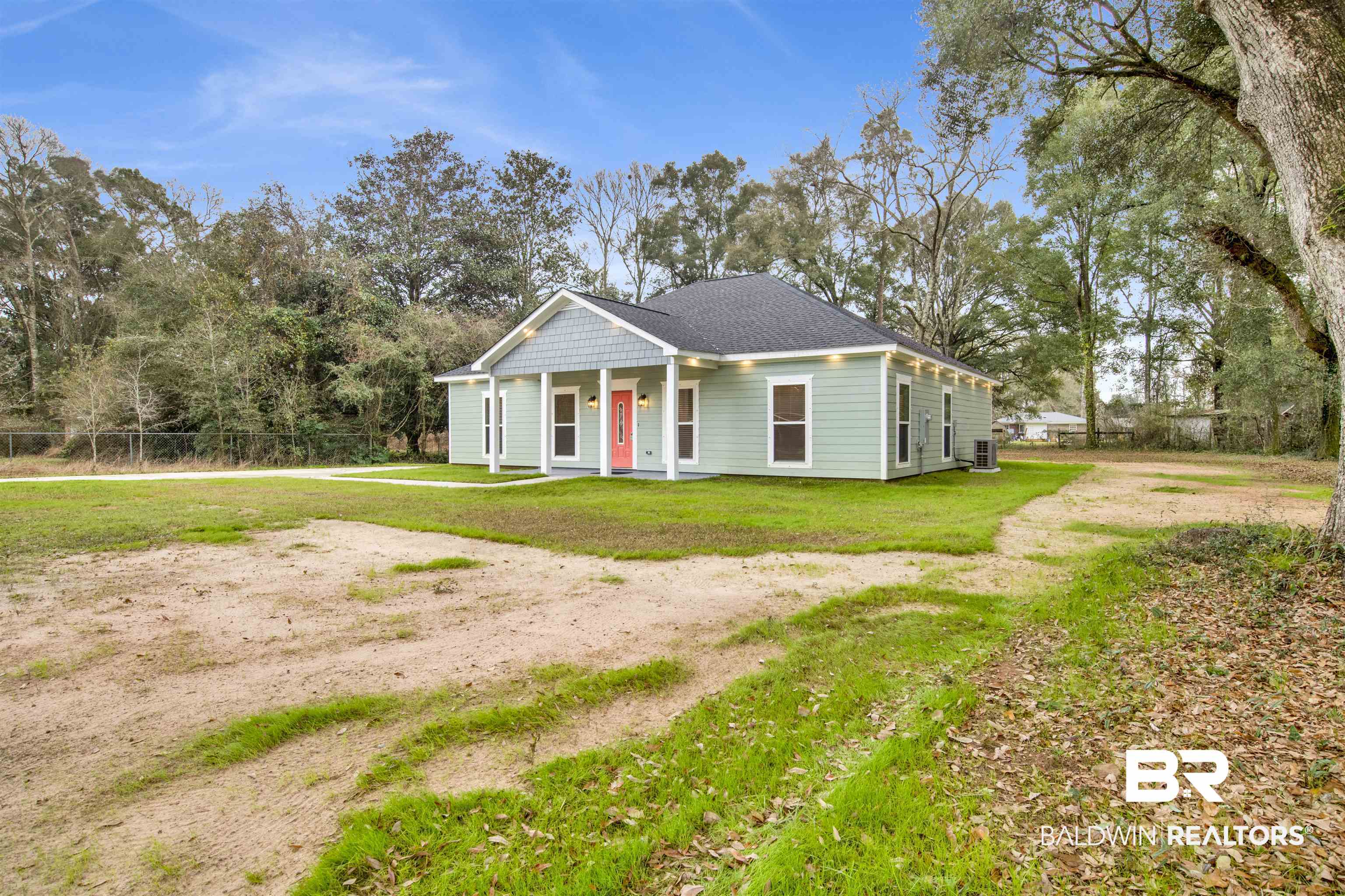 10871 Somerset Road Grand Bay, AL 36541 - Photo 28 of 31 View of front facade featuring cooling unit and a front yard
