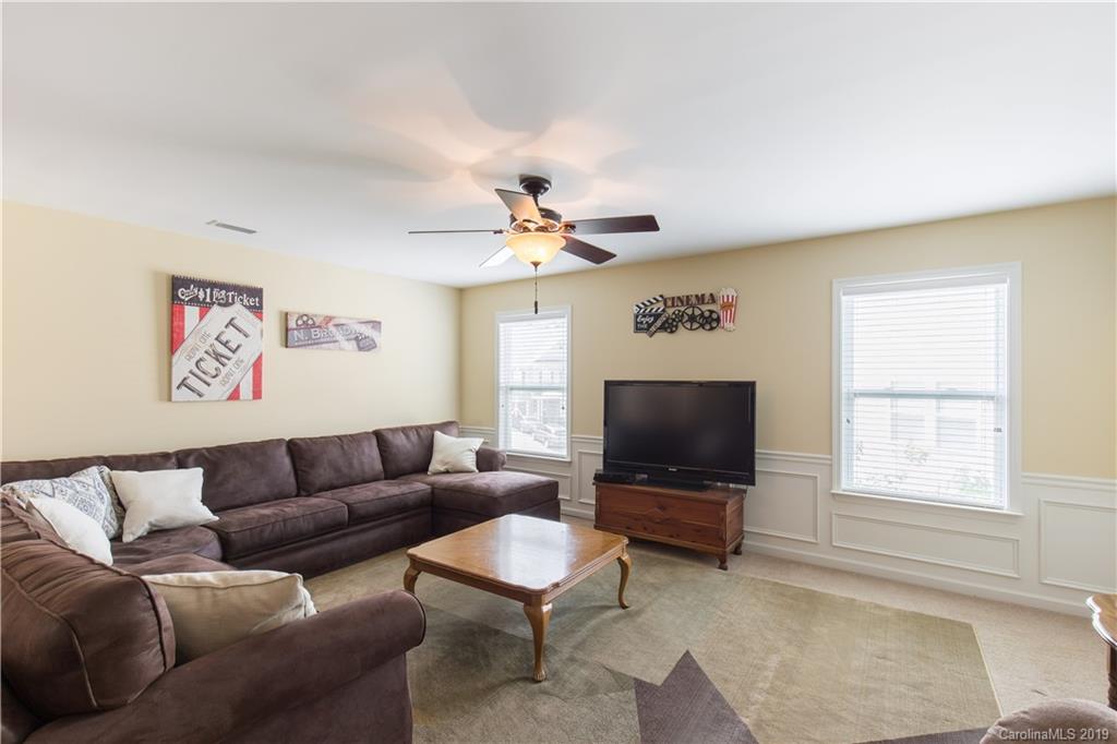 3347 Mandrake Court Tega Cay, SC 29708 - Photo 13 of 27 a living room with furniture and a flat screen tv