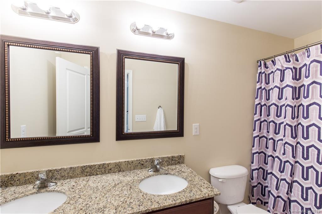 3347 Mandrake Court Tega Cay, SC 29708 - Photo 14 of 27 a bathroom with a granite countertop sink and a mirror