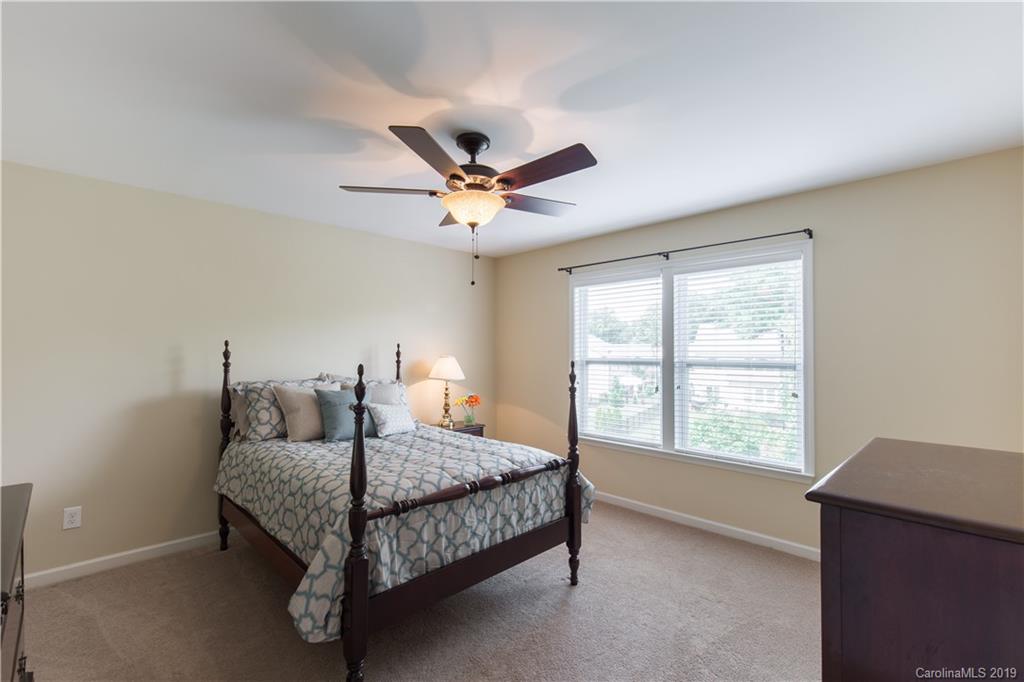 3347 Mandrake Court Tega Cay, SC 29708 - Photo 15 of 27 a bedroom with a bed and window