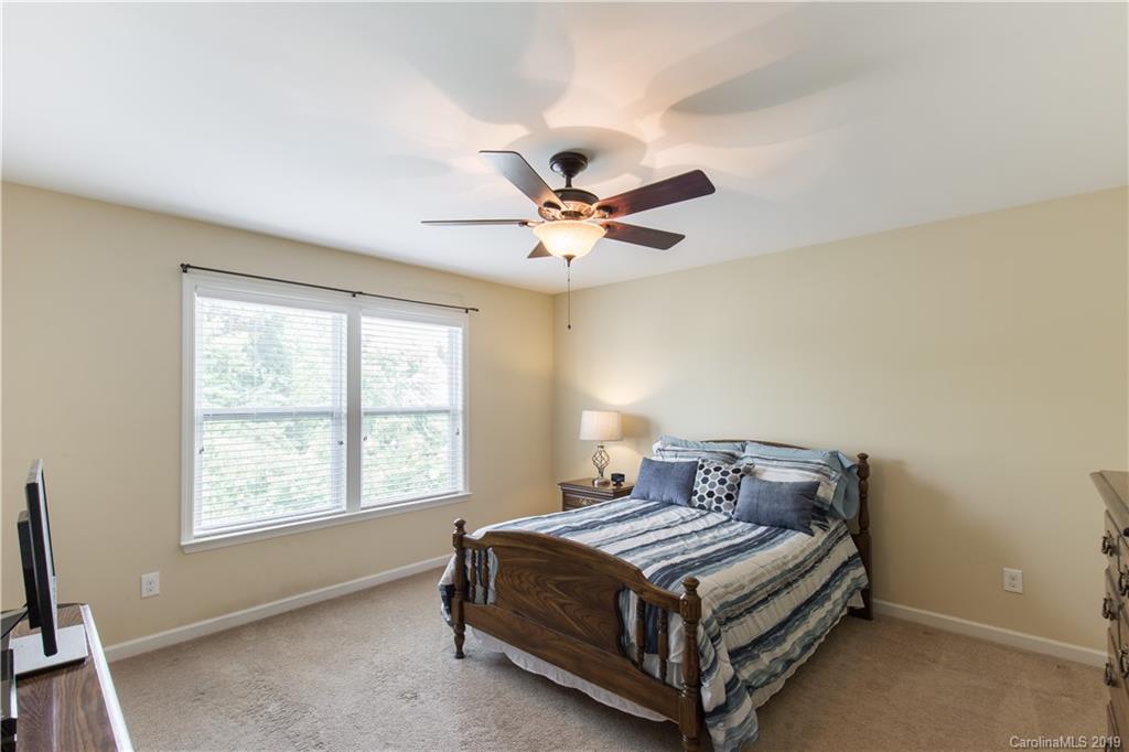 3347 Mandrake Court Tega Cay, SC 29708 - Photo 17 of 27 a bedroom with a bed and window