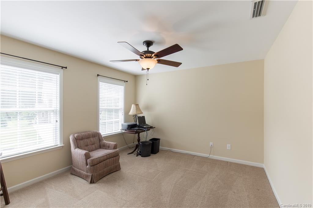 3347 Mandrake Court Tega Cay, SC 29708 - Photo 18 of 27 a living room with furniture and a ceiling fan