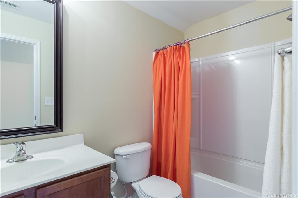 3347 Mandrake Court Tega Cay, SC 29708 - Photo 23 of 27 a bathroom with a sink and a toilet